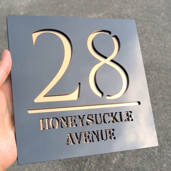 Personalized floating door number sign in matte black and copper