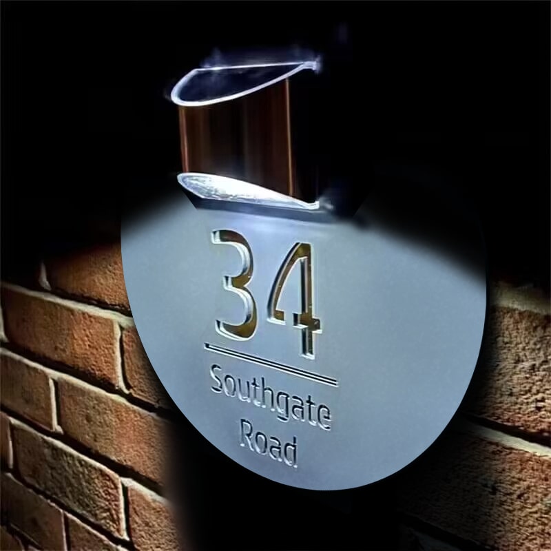 Personalized house number and street name on a solar house plate