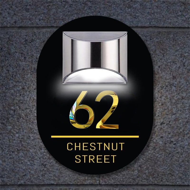 Personalized oval solar 3D house sign on a front wall