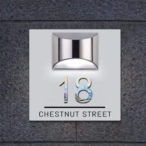 3D collage detail on a modern solar door plaque